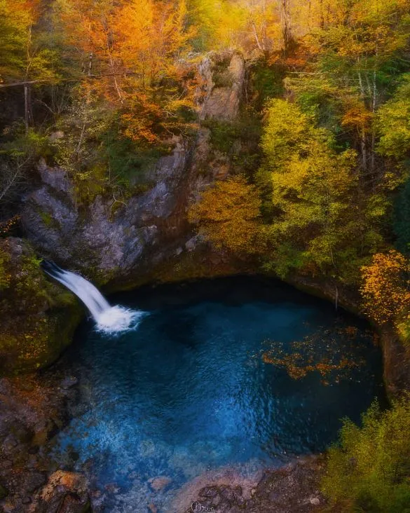 Syri i Kaltër — the Blue Eye natural spring near Theth, Albania — at its most photogenic in full summer light